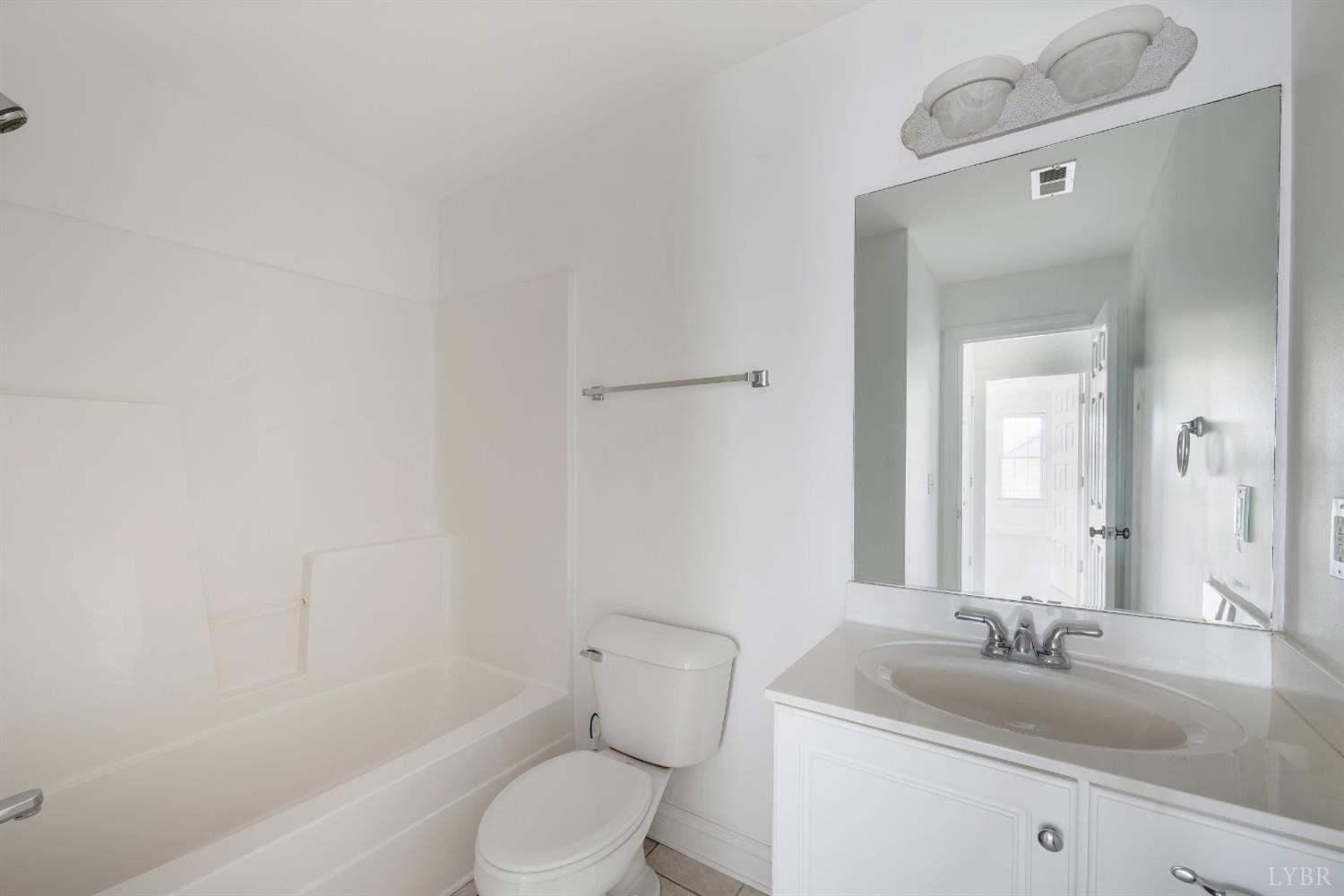 1166 Caperton Way Forest, VA 24551 - Photo 36 of 59 a bathroom with a sink and a mirror