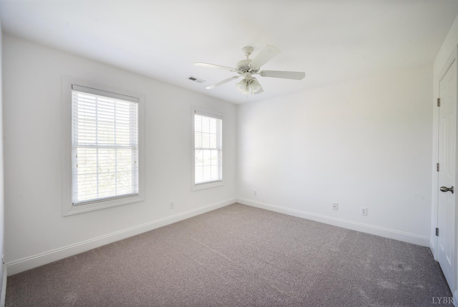 1166 Caperton Way Forest, VA 24551 - Photo 37 of 59 an empty room with windows and ceiling fan