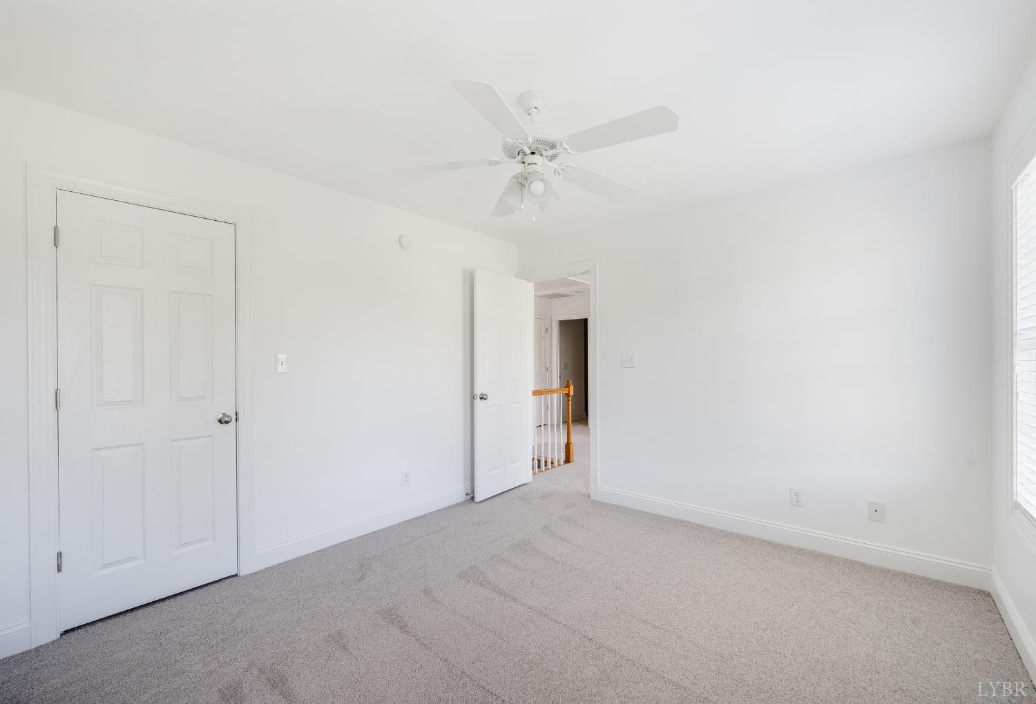 1166 Caperton Way Forest, VA 24551 - Photo 38 of 59 an empty room with a ceiling fan and a window