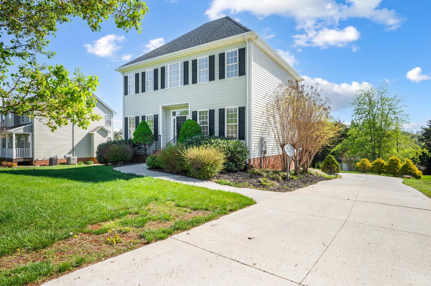 1166 Caperton Way Forest, VA 24551 - Photo 44 of 59 a front view of a house with garden