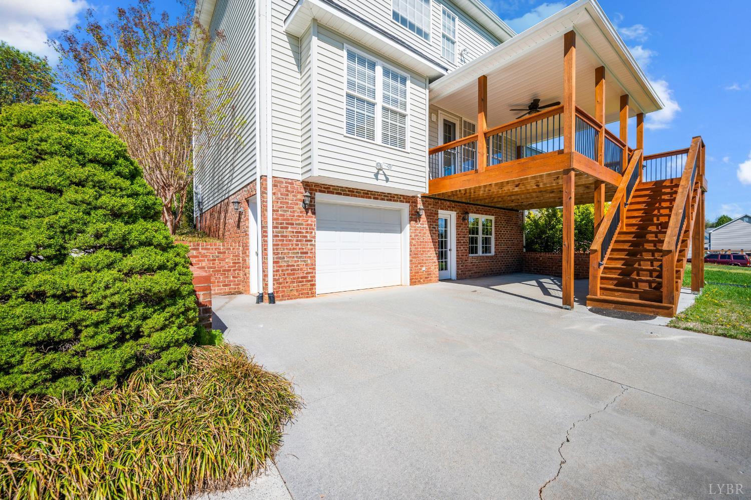 1166 Caperton Way Forest, VA 24551 - Photo 45 of 59 a front view of a building with garden