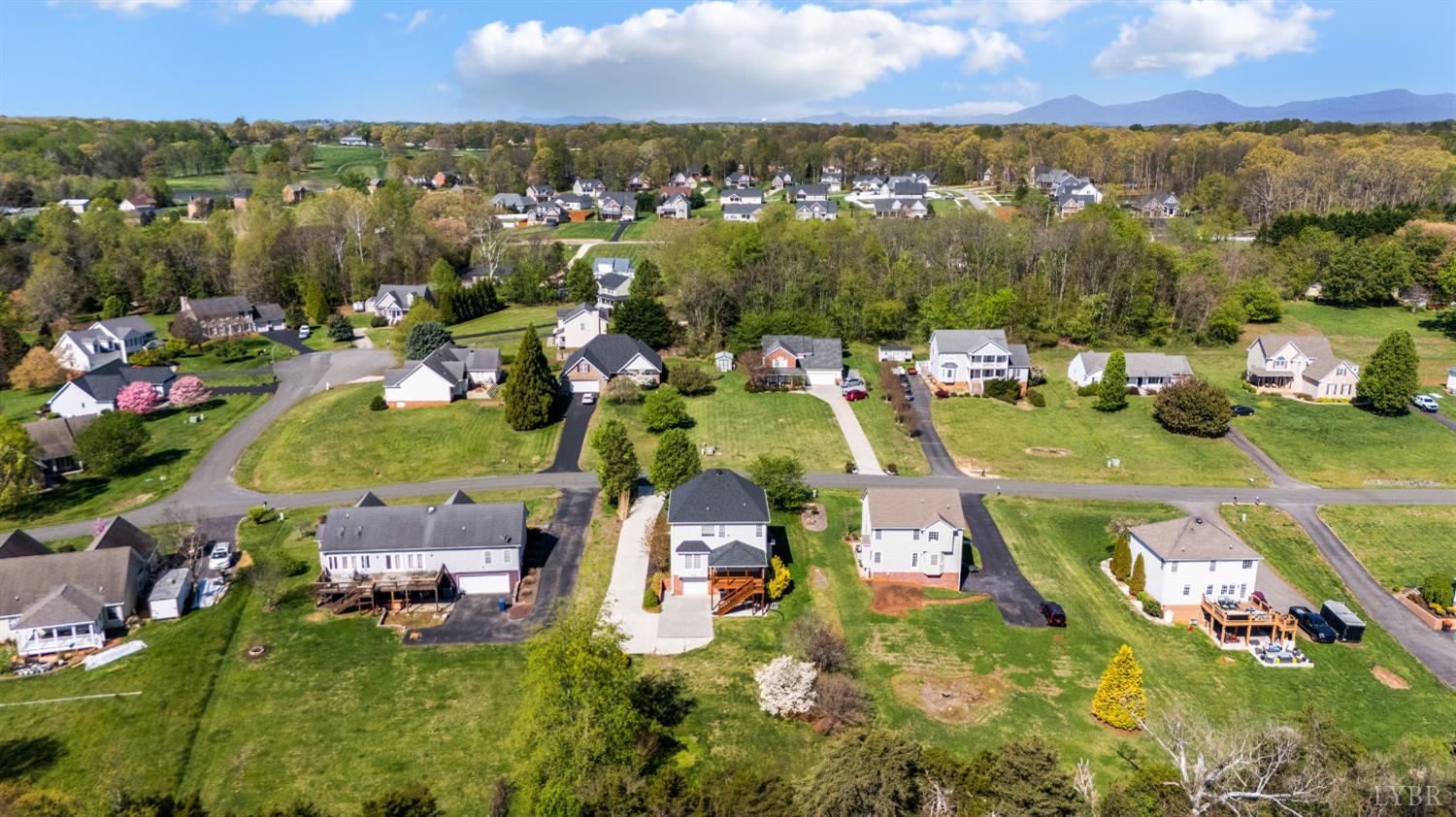1166 Caperton Way Forest, VA 24551 - Photo 53 of 59 an aerial view of a house with a garden and mountain view in back