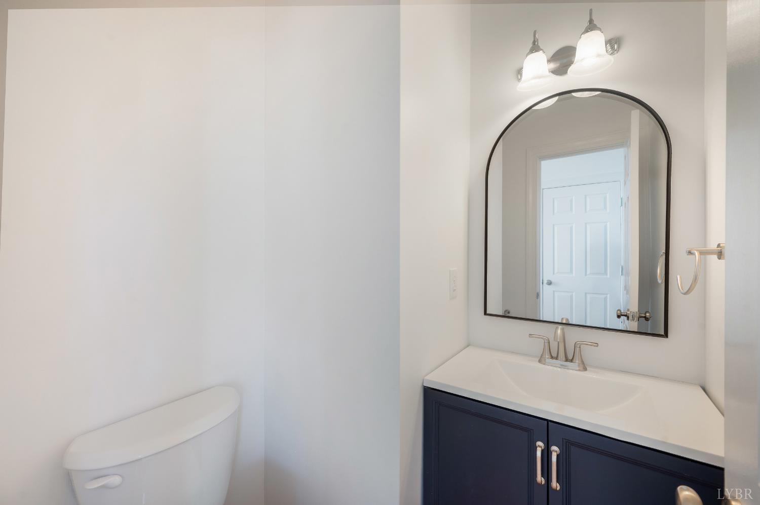 1166 Caperton Way Forest, VA 24551 - Photo 7 of 59 a bathroom with a toilet sink and mirror