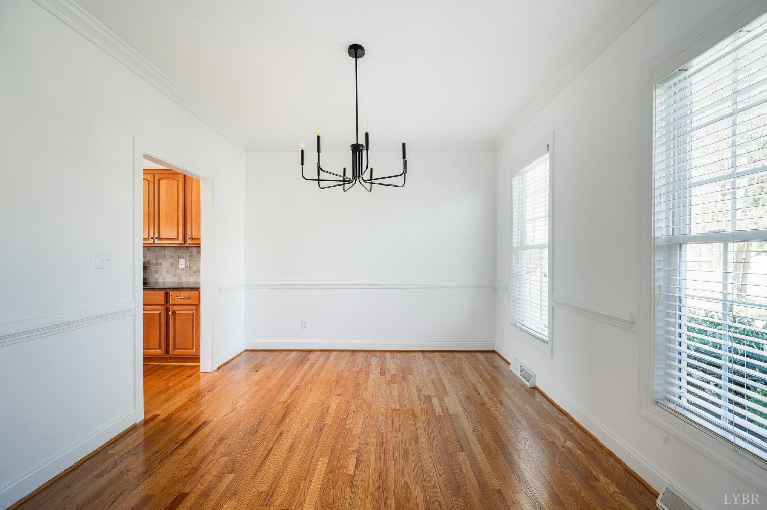 1166 Caperton Way Forest, VA 24551 - Photo 8 of 59 a view of empty room with wooden floor and window