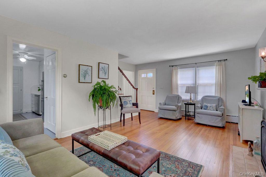 5 Newell Road Merrick, NY 11566 - Photo 4 of 19 a living room with furniture and wooden floor