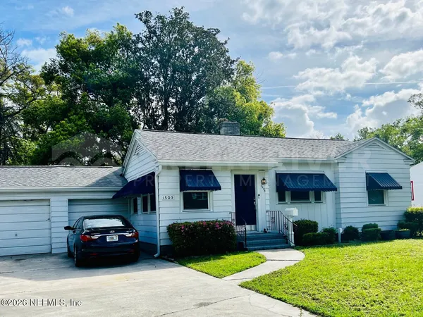 a view of a car parked in front of a house
