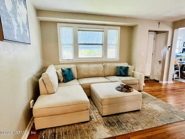 a living room with furniture and a window