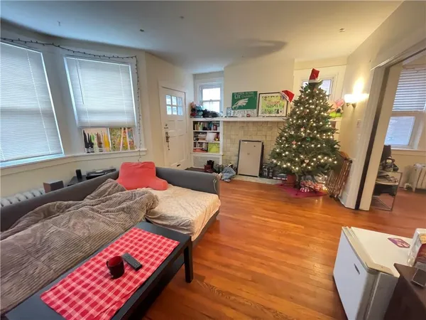 a bed room with a bed window and a couch
