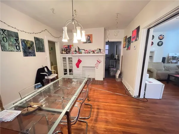 a view of a kitchen with fridge and workspace