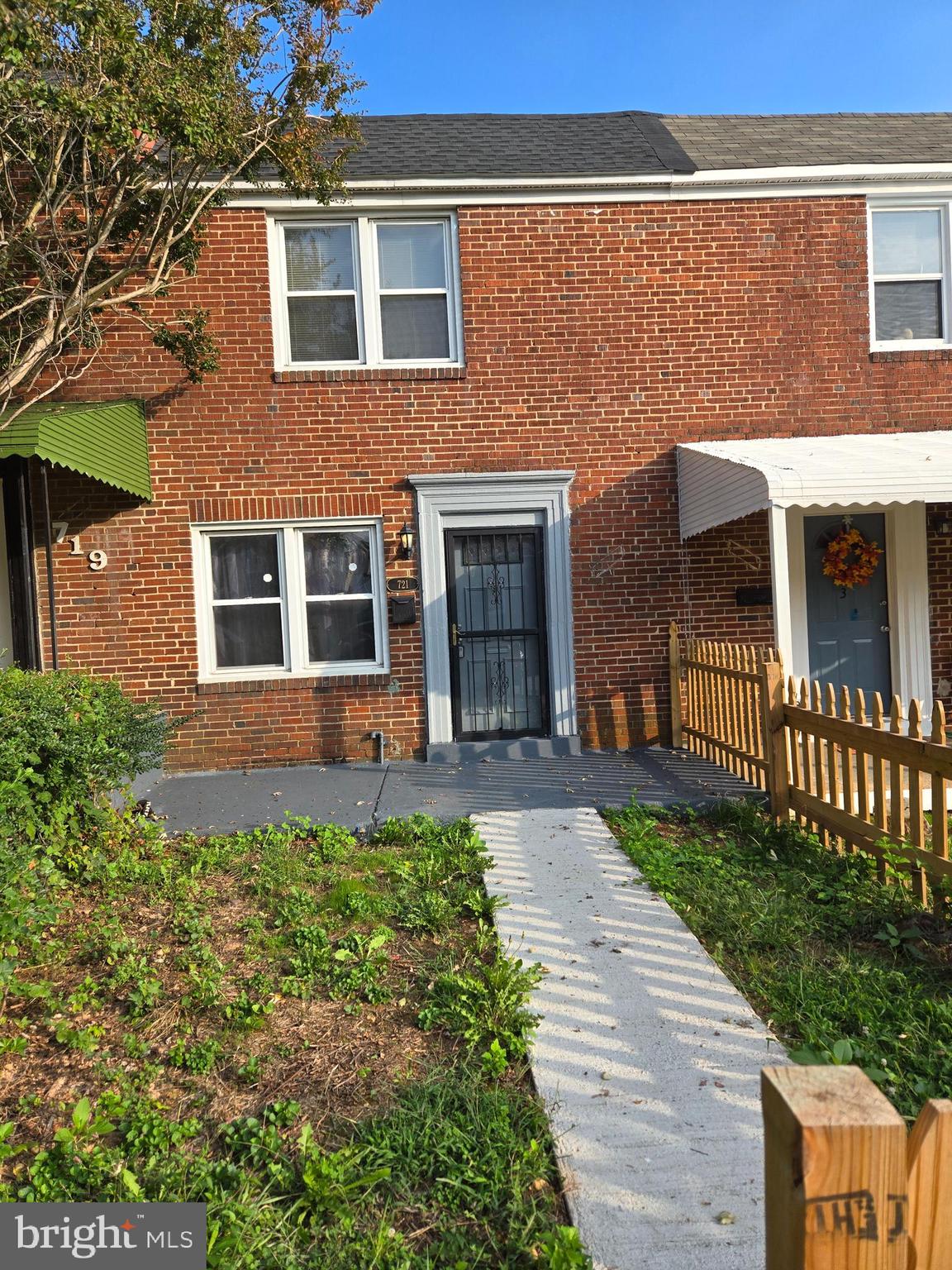 721 Roundview Road Baltimore, MD 21225 - Photo 1 of 30 a front view of a house with a yard