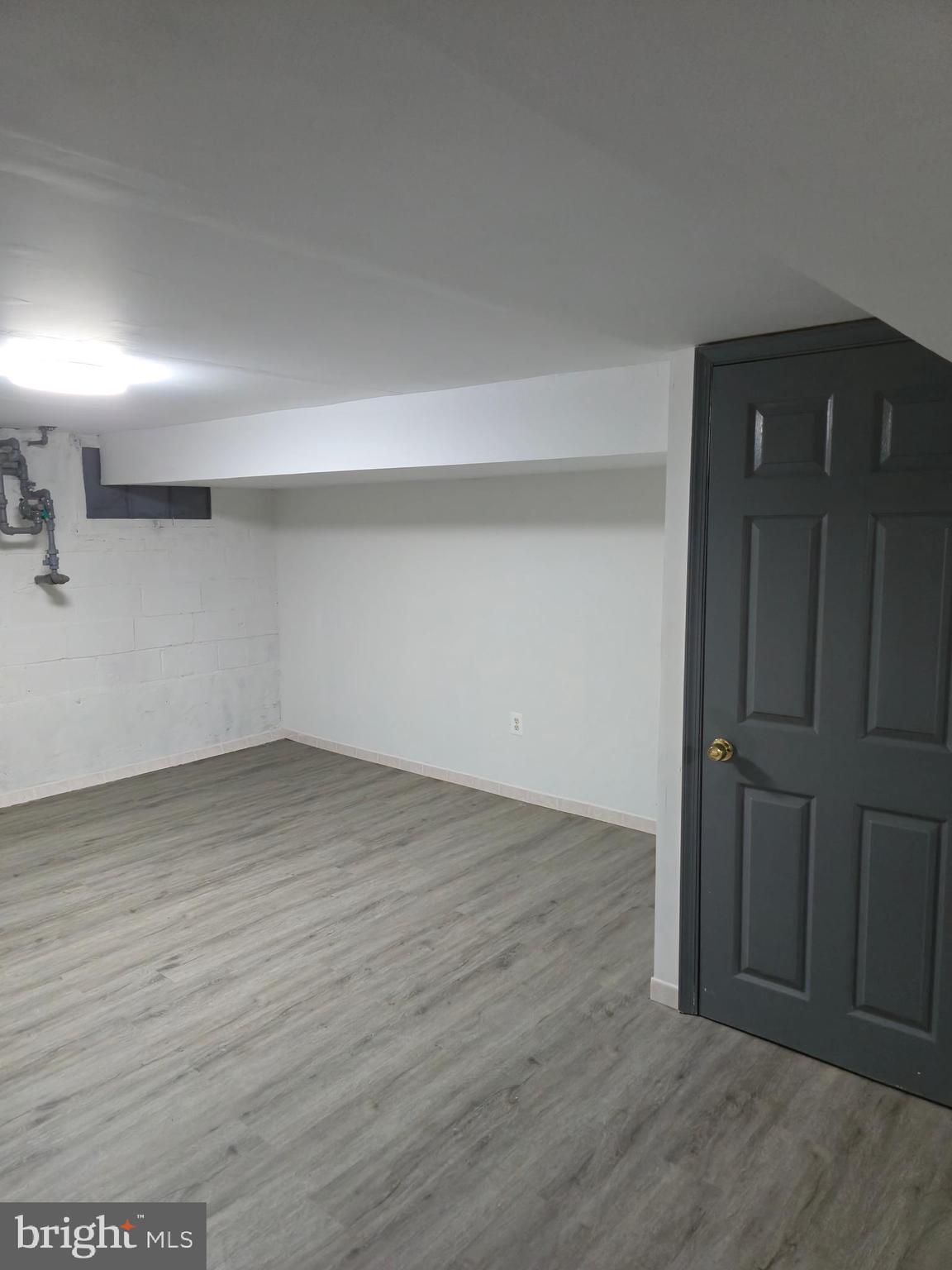 721 Roundview Road Baltimore, MD 21225 - Photo 11 of 30 wooden floor in an empty room