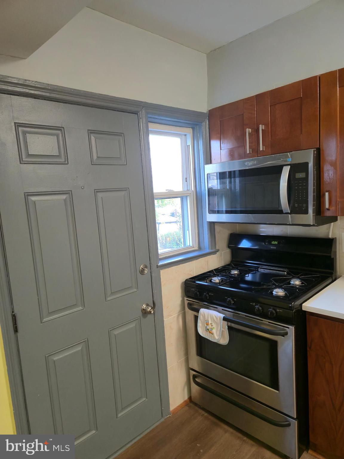 721 Roundview Road Baltimore, MD 21225 - Photo 19 of 30 a stove top oven sitting inside of a kitchen