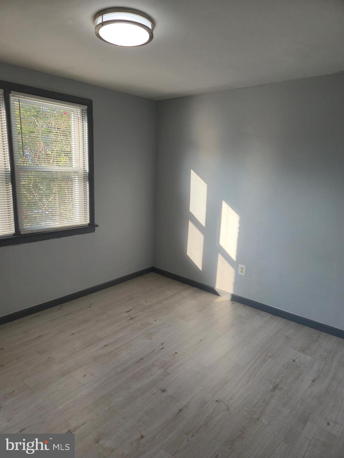 721 Roundview Road Baltimore, MD 21225 - Photo 24 of 30 an empty room with a window