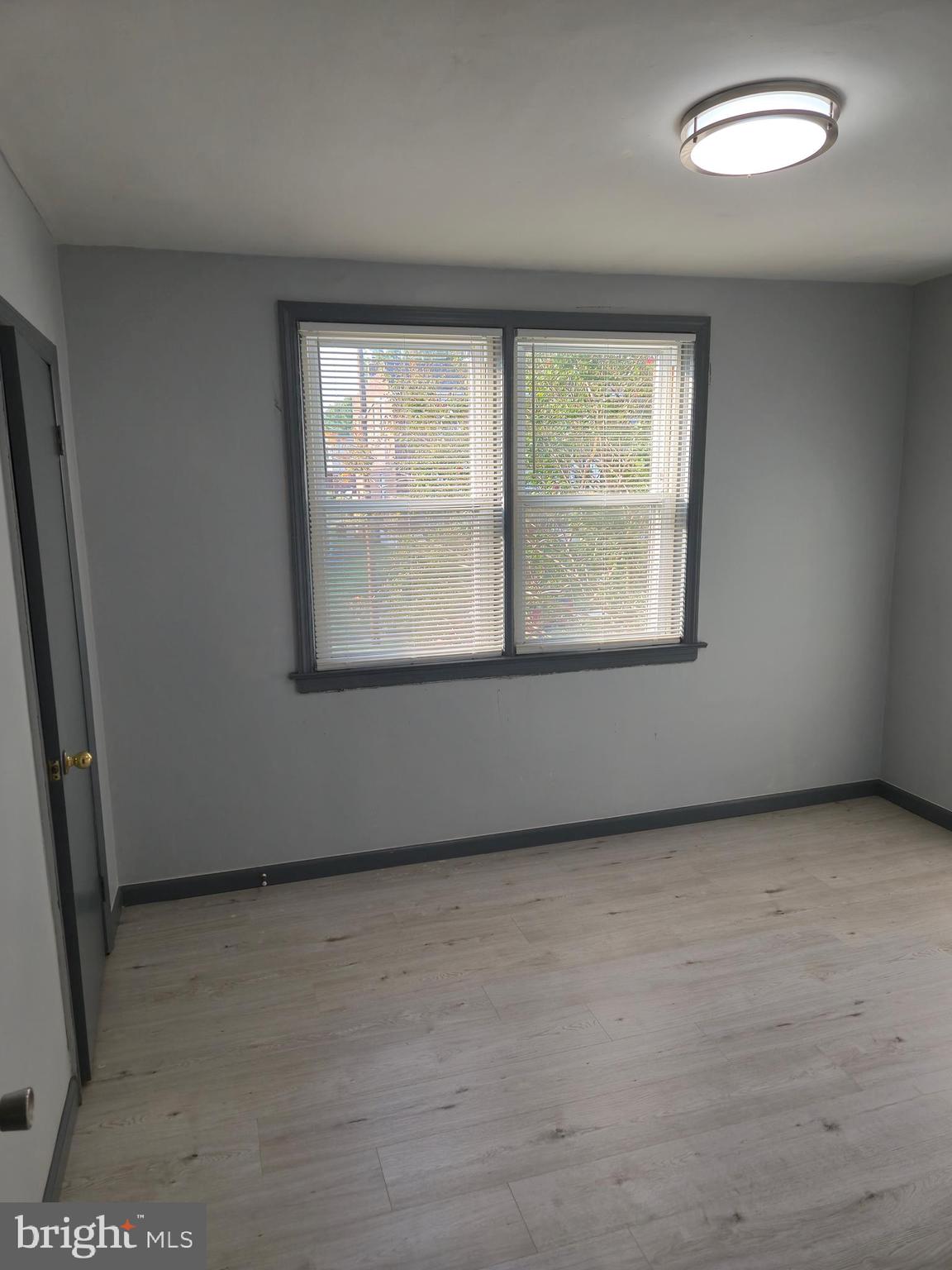 721 Roundview Road Baltimore, MD 21225 - Photo 25 of 30 an empty room with a window