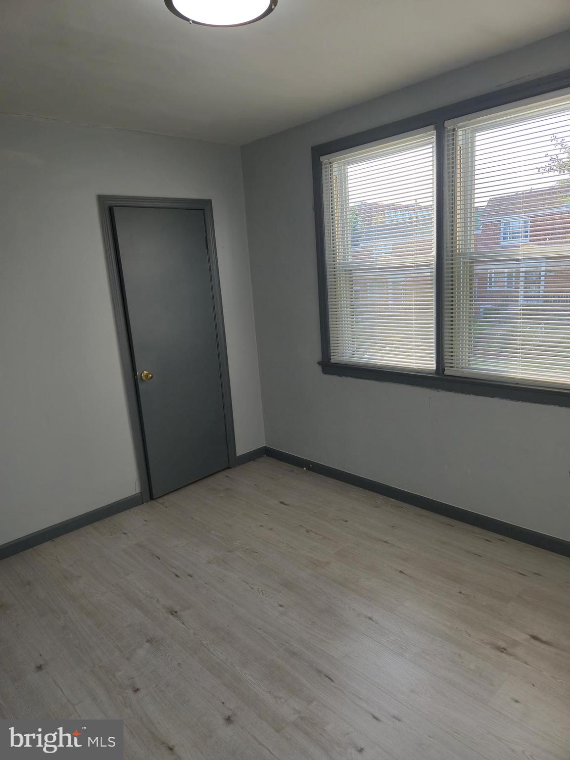 721 Roundview Road Baltimore, MD 21225 - Photo 26 of 30 an empty room with a window