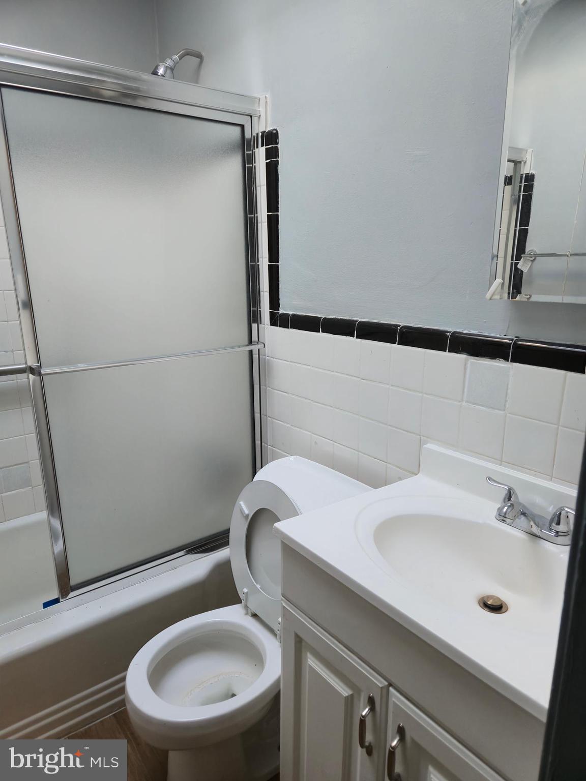 721 Roundview Road Baltimore, MD 21225 - Photo 30 of 30 a bathroom with a sink a toilet and shower