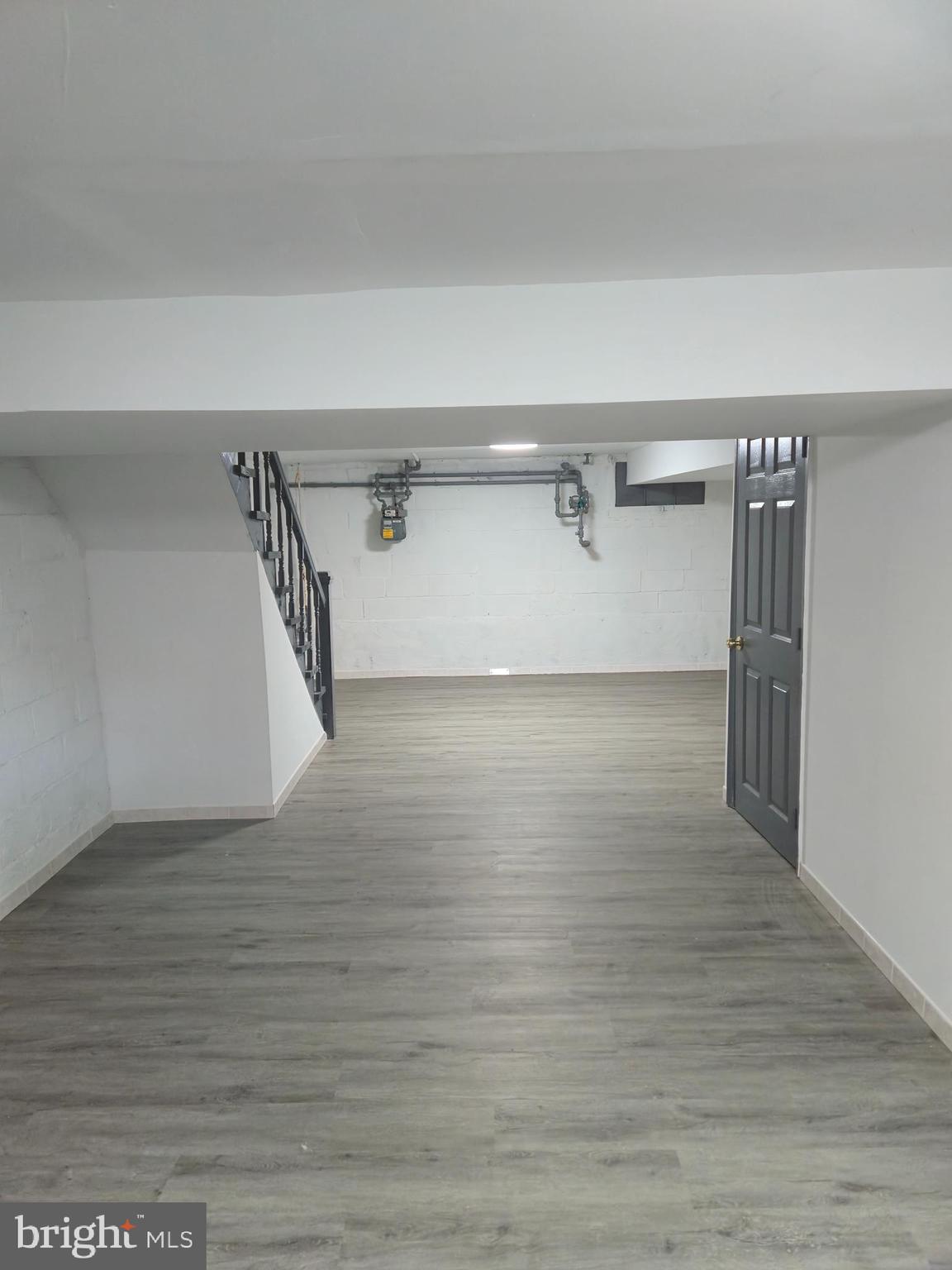 721 Roundview Road Baltimore, MD 21225 - Photo 9 of 30 a view of a room with wooden floor