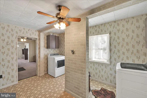 a bathroom with a sink a mirror and a shower