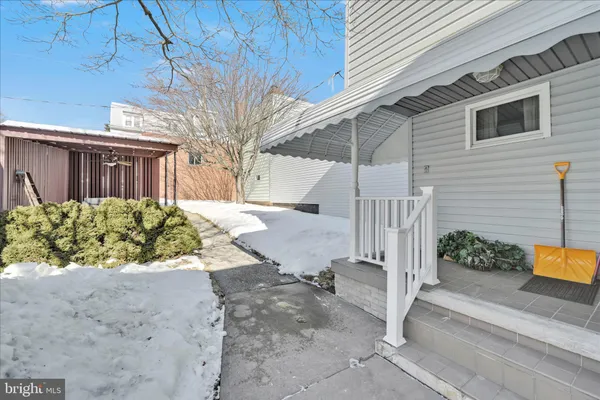 a view of a backyard with small garden