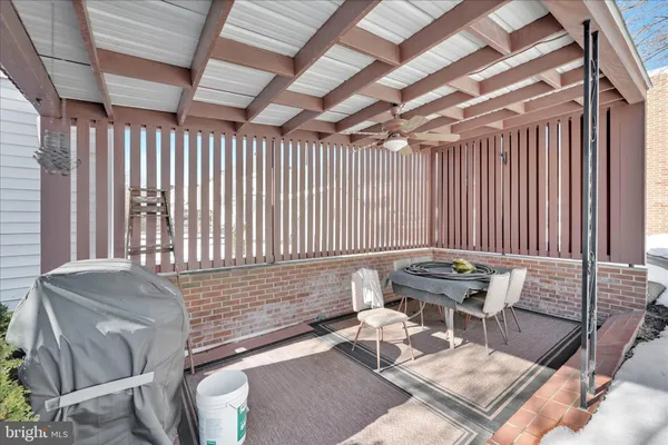 a couch sitting in a room next to a window