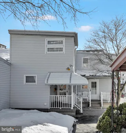 a front view of a house with a porch