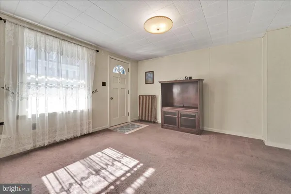 a view of livingroom with furniture and windows