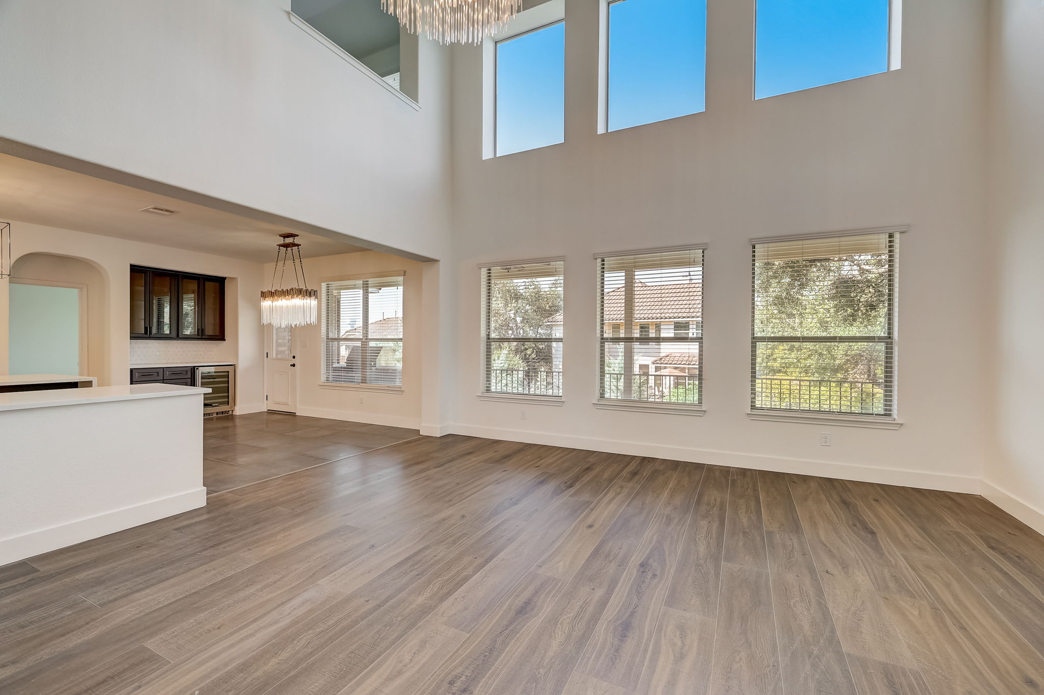 16012 Spillman Ranch Loop Austin, TX 78738 - Photo 10 of 38 A spacious great room features soaring ceilings and abundant natural light.