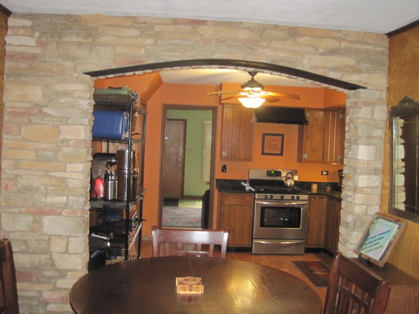 2419 Elm Street River Grove, IL 60171 - Photo 3 of 12 a view of kitchen with kitchen island microwave and stove