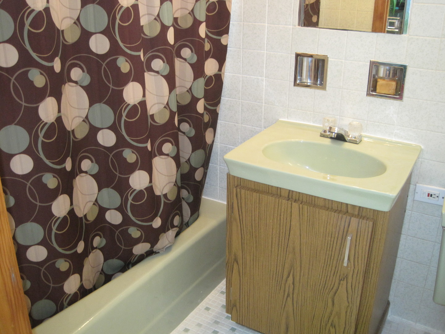 2419 Elm Street River Grove, IL 60171 - Photo 9 of 12 a bathroom with a sink and a mirror