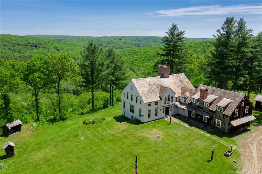 a aerial view of a house with backyard garden and lake view