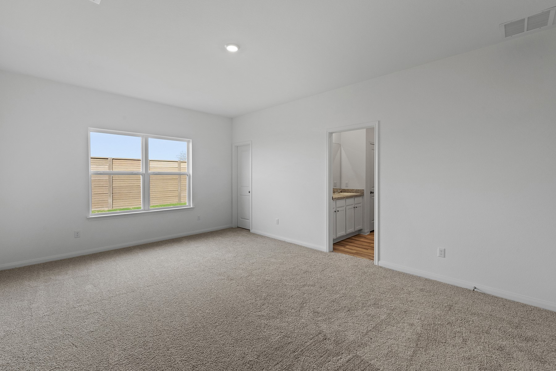 14520 Wahlbergs Way Elgin, TX 78621 - Photo 4 of 13 an empty room with a window and fireplace