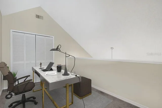 an empty room with a ceiling fan and a window