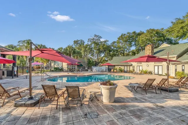 a view of a chairs and table in the patio