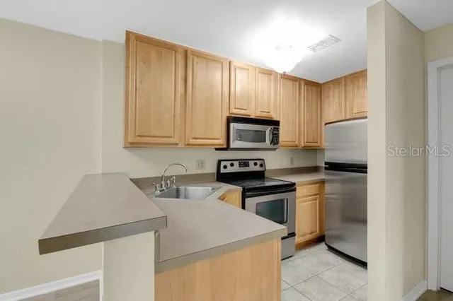 a kitchen with a stove and a microwave