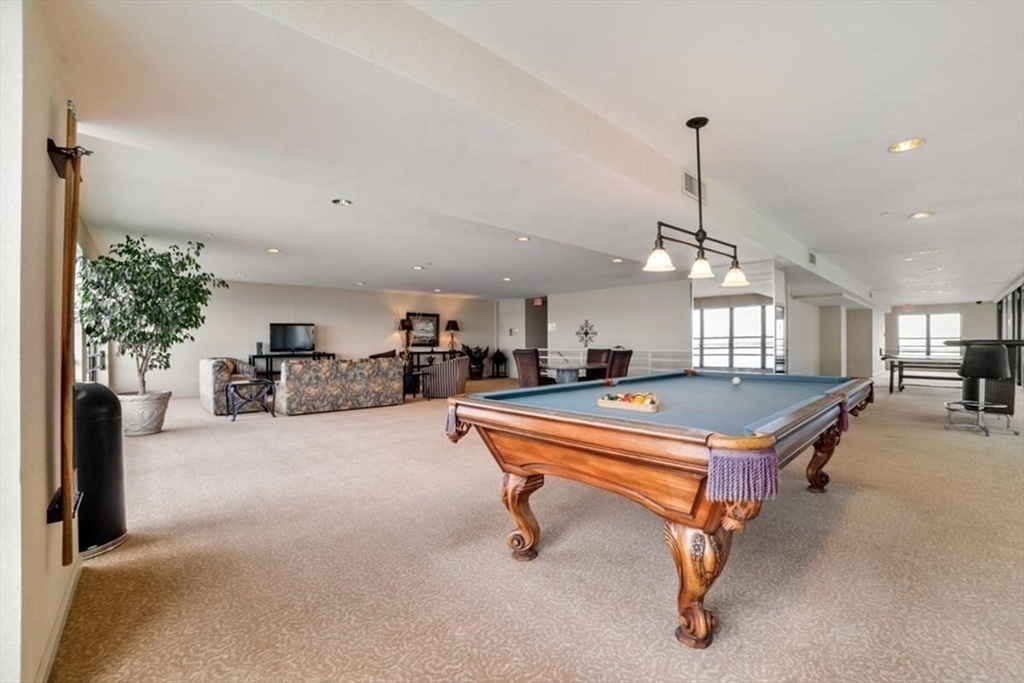 3 Seal Harbor Road, Unit 632 Winthrop, MA 02152 - Photo 31 of 34 a room with furniture and a chandelier
