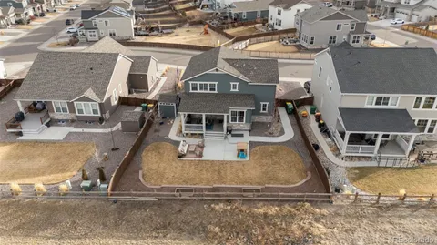 an aerial view of a house with a ocean view
