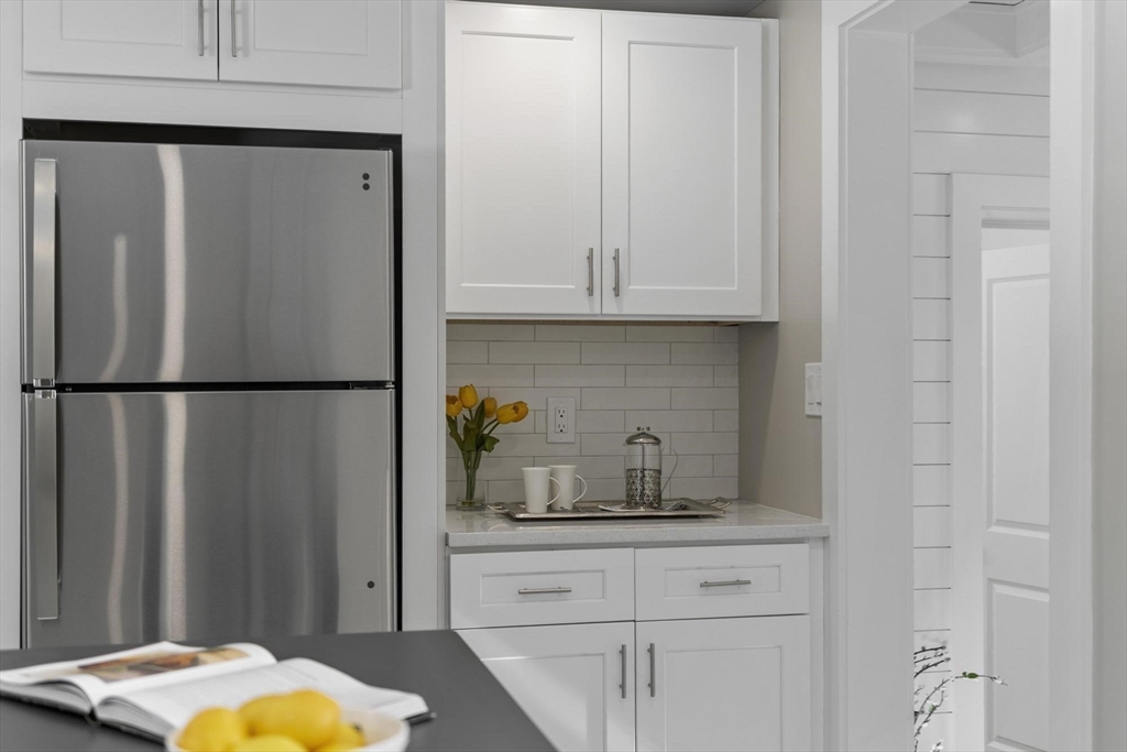 68 East Street Hanover, MA 02339 - Photo 16 of 39 a kitchen with a refrigerator and cabinets
