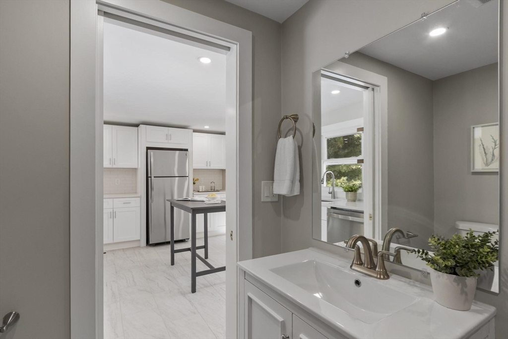 68 East Street Hanover, MA 02339 - Photo 19 of 39 a bathroom with a sink and a mirror