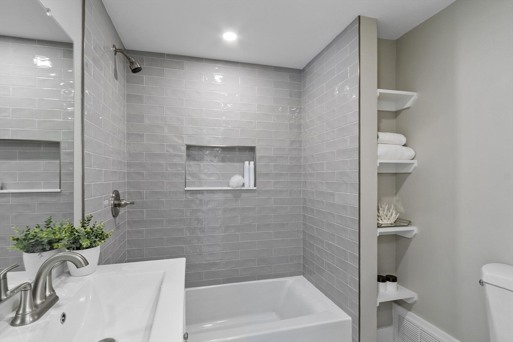 68 East Street Hanover, MA 02339 - Photo 20 of 39 a bathroom with a sink a toilet and shower