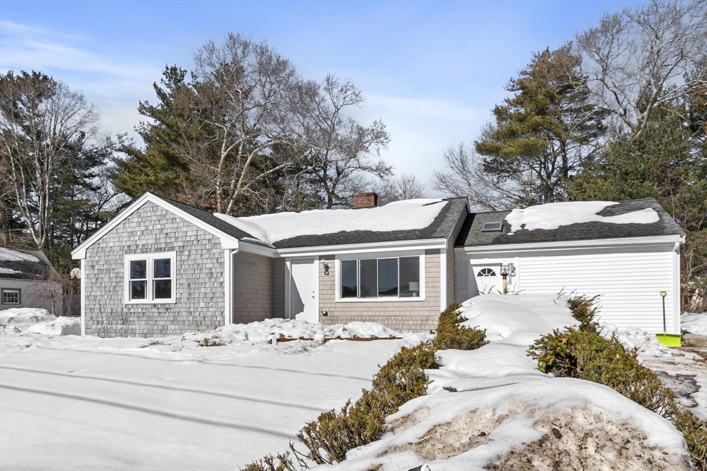 68 East Street Hanover, MA 02339 - Photo 2 of 39 a front view of a house with a yard