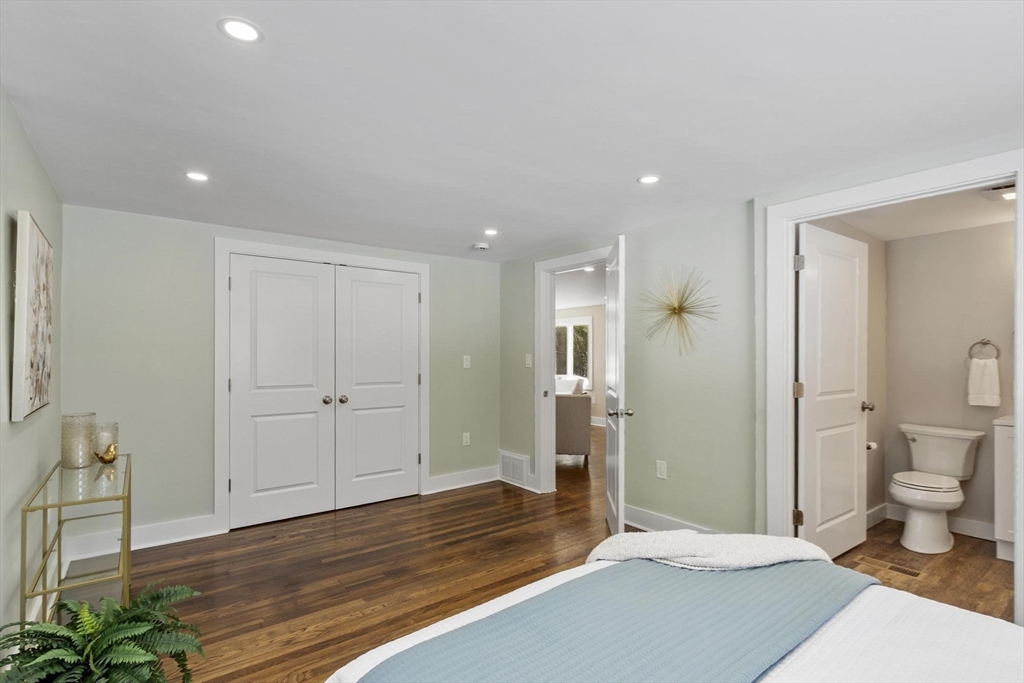 68 East Street Hanover, MA 02339 - Photo 23 of 39 a bedroom with a bed and a view of bathroom