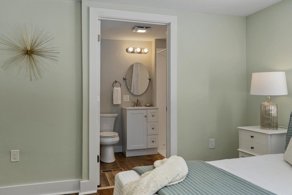 68 East Street Hanover, MA 02339 - Photo 24 of 39 a bathroom with a toilet sink and a mirror
