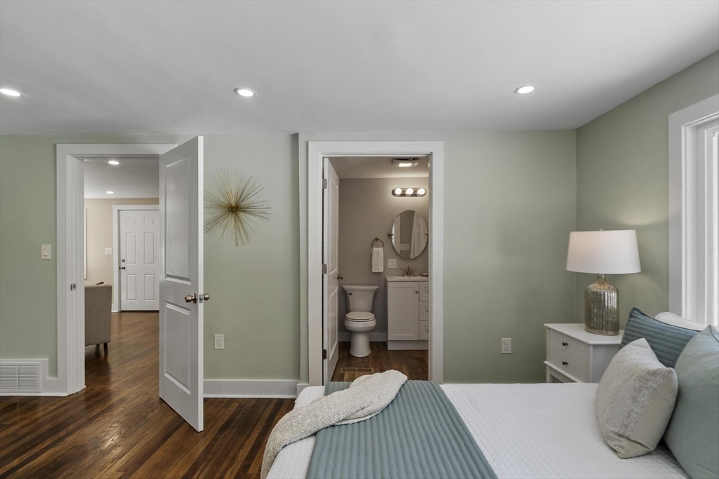 68 East Street Hanover, MA 02339 - Photo 25 of 39 a bedroom with a bed and a lamp