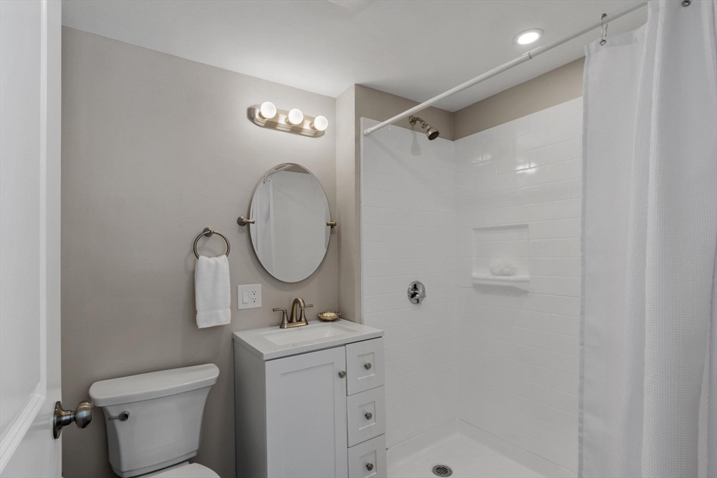 68 East Street Hanover, MA 02339 - Photo 27 of 39 a bathroom with a toilet sink and shower