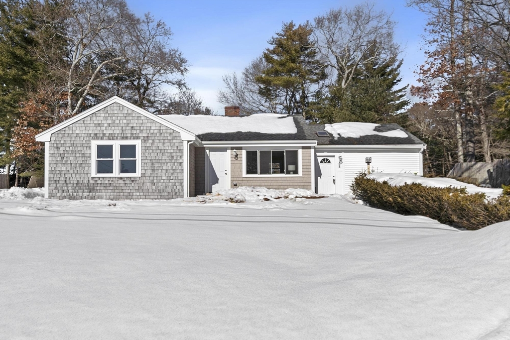68 East Street Hanover, MA 02339 - Photo 3 of 39 a front view of a house with a yard and trees