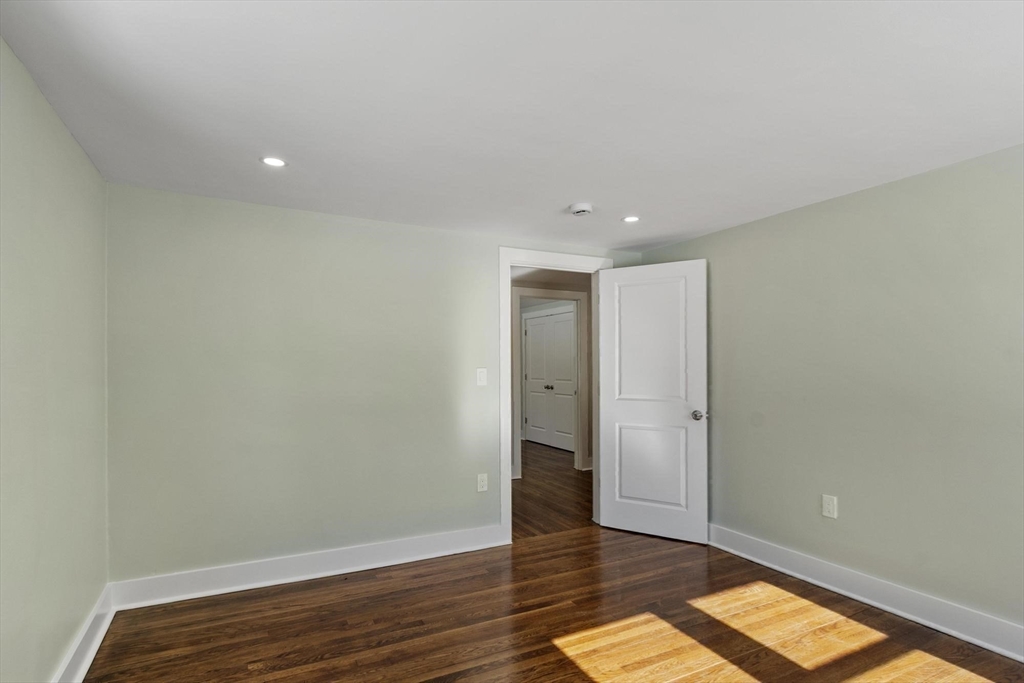 68 East Street Hanover, MA 02339 - Photo 36 of 39 a view of hallway with a ceiling fan and wooden floor