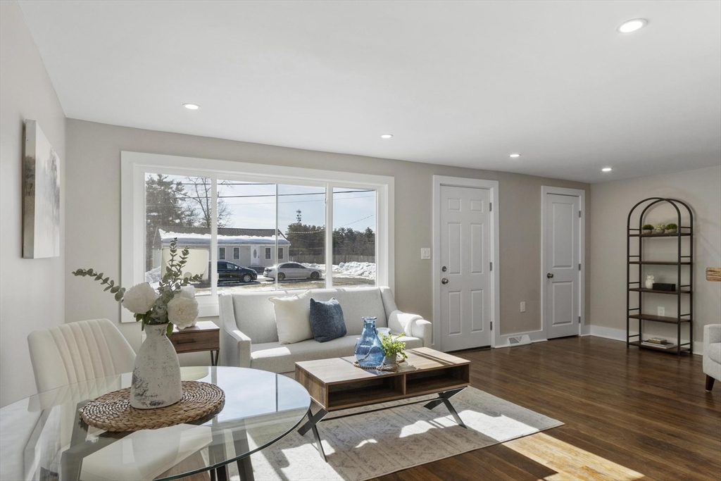 68 East Street Hanover, MA 02339 - Photo 7 of 39 a living room with furniture and a wooden floor