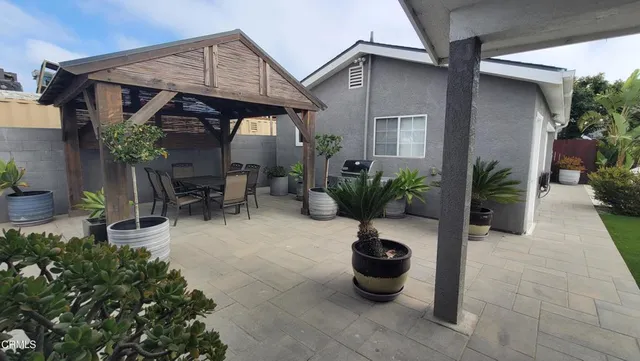 a house view with a backyard space