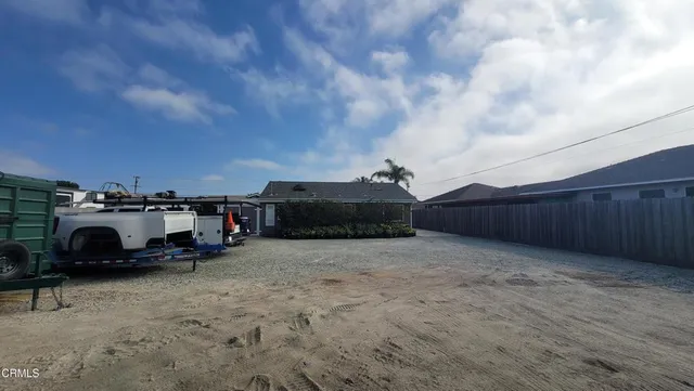 a house view with a backyard space