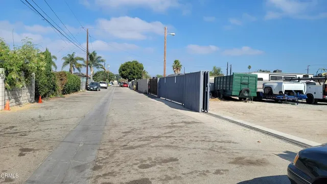 a view of balcony with wooden fence